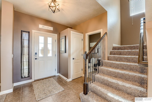 8902 N 161st Ave, Bennington, NE 68007 - tiled entryway featuring stairway and baseboards