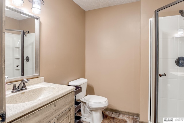 8902 N 161st Ave, Bennington, NE 68007 - full bath featuring a shower stall, toilet, vanity, a textured ceiling, and wood finished floors