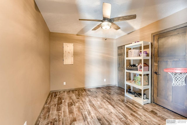 8902 N 161st Ave, Bennington, NE 68007 - unfurnished room featuring a ceiling fan, wood finished floors, and baseboards
