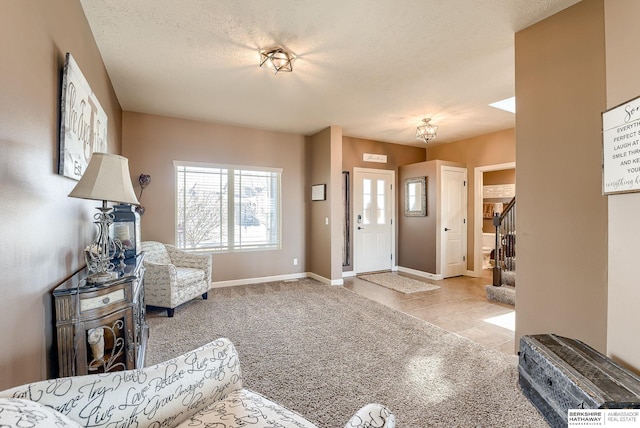8902 N 161st Ave, Bennington, NE 68007 - entrance foyer featuring baseboards, stairs, carpet, a textured ceiling, and tile patterned floors