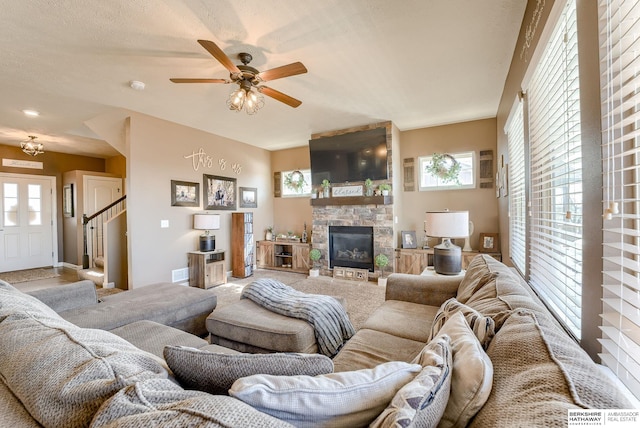 8902 N 161st Ave, Bennington, NE 68007 - carpeted living area with ceiling fan, stairway, and a stone fireplace