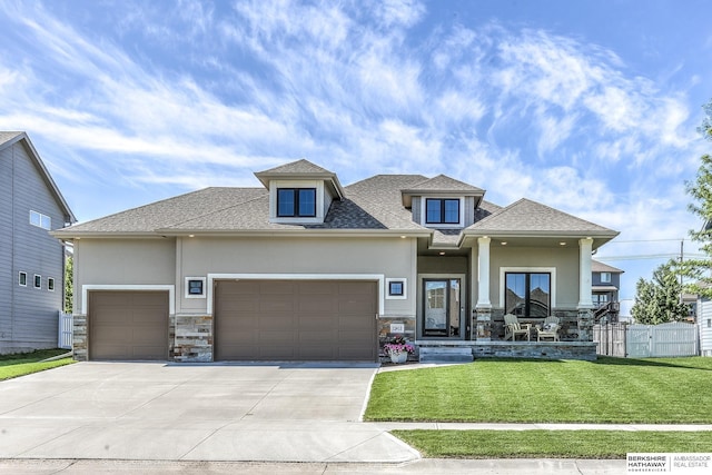 view of front of house featuring stucco siding, an attached garage, stone siding, and concrete driveway