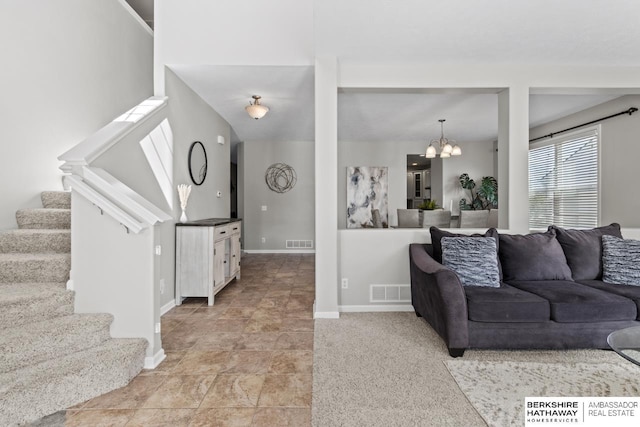 8917 N 157th St, Bennington, NE 68007 - living area featuring a chandelier, stairs, and baseboards