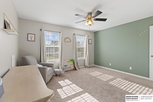 8917 N 157th St, Bennington, NE 68007 - living area featuring ceiling fan, carpet flooring, and baseboards