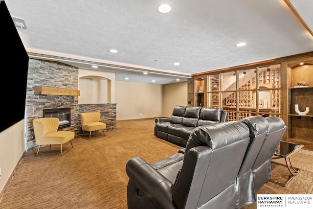 8917 N 157th St, Bennington, NE 68007 - living area with carpet flooring, recessed lighting, a stone fireplace, and a textured ceiling