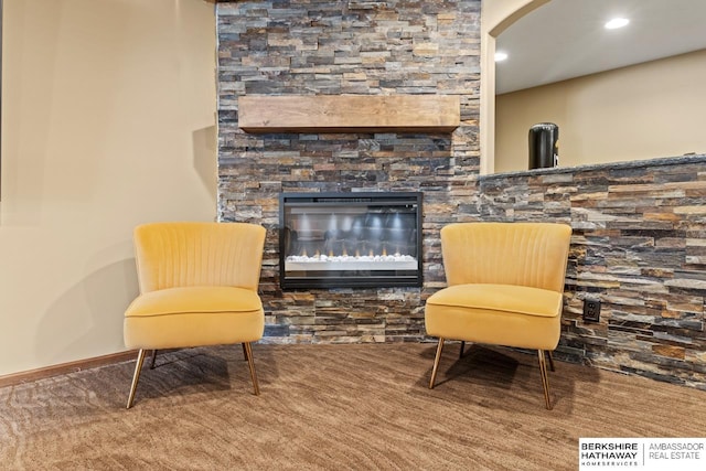 8917 N 157th St, Bennington, NE 68007 - living area featuring a stone fireplace, carpet flooring, recessed lighting, and baseboards