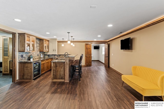 8917 N 157th St, Bennington, NE 68007 - kitchen with wine cooler, a kitchen breakfast bar, glass insert cabinets, dark wood-type flooring, and backsplash