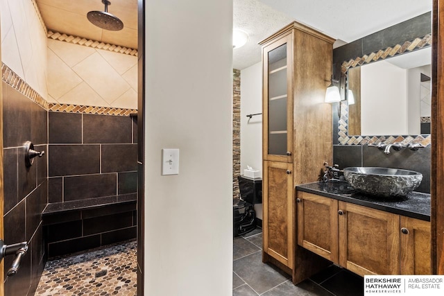 8917 N 157th St, Bennington, NE 68007 - full bath featuring a tile shower, vanity, and tile patterned flooring