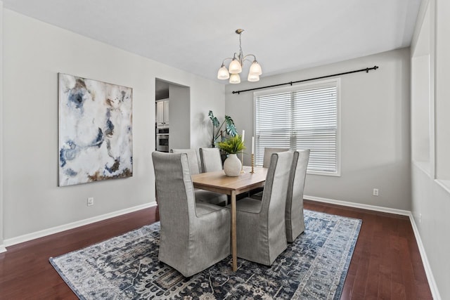 8917 N 157th St, Bennington, NE 68007 - dining space with a chandelier, wood finished floors, and baseboards