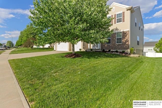 8917 N 157th St, Bennington, NE 68007 - obstructed view of property featuring driveway, brick siding, a front lawn, and a garage