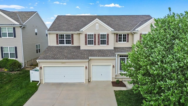 8917 N 157th St, Bennington, NE 68007 - traditional-style home with concrete driveway, an attached garage, roof with shingles, and a front yard