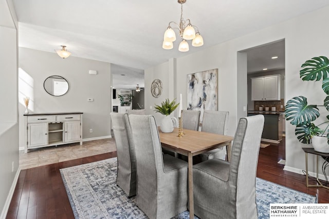 8917 N 157th St, Bennington, NE 68007 - dining space with a chandelier, hardwood / wood-style flooring, and baseboards