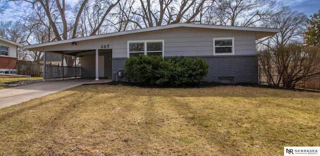467 Steinway Rd, Lincoln, NE 68505 - view of front facade with brick siding, driveway, and an attached carport
