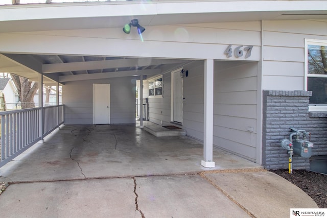 467 Steinway Rd, Lincoln, NE 68505 - garage featuring a carport and driveway