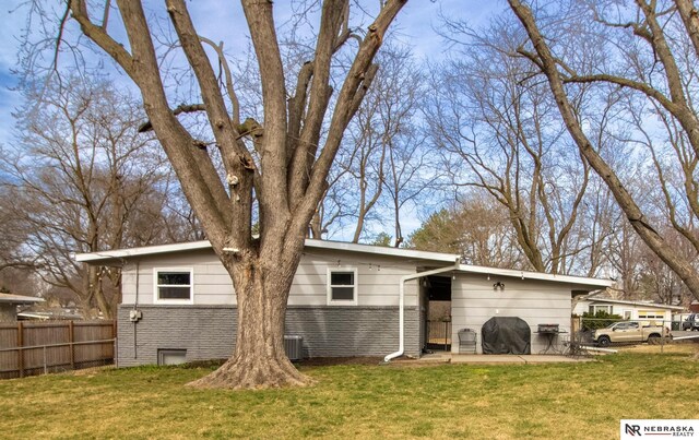 467 Steinway Rd, Lincoln, NE 68505 - rear view of house featuring brick siding
