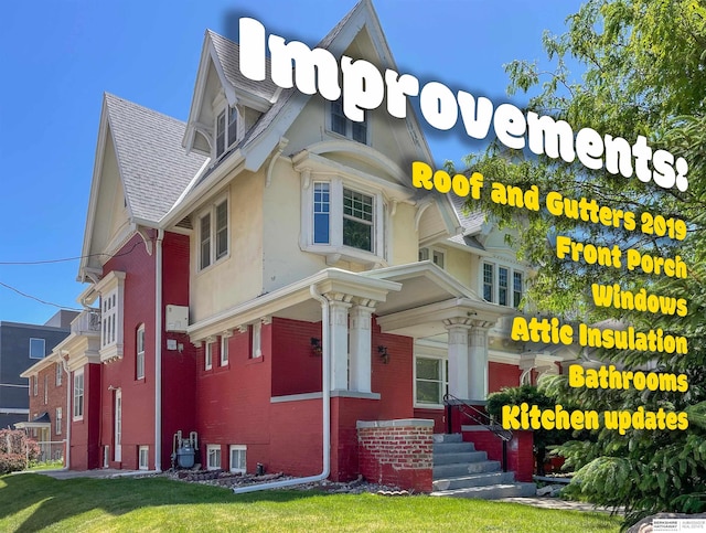 401 S 38th Ave, Omaha, NE 68131 - view of front of property featuring brick siding, a shingled roof, and stucco siding