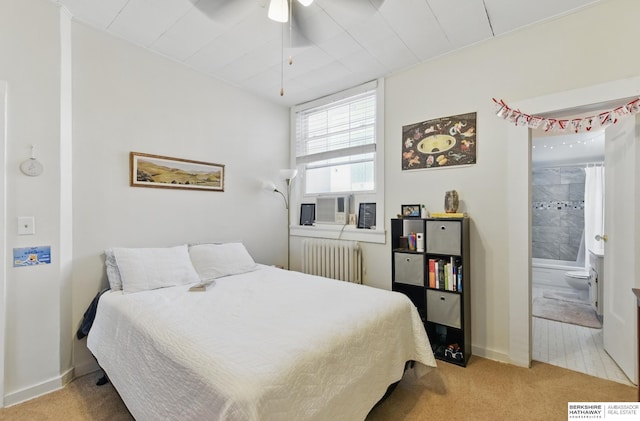 401 S 38th Ave, Omaha, NE 68131 - bedroom featuring radiator, light colored carpet, baseboards, and ensuite bathroom