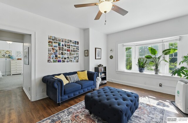 401 S 38th Ave, Omaha, NE 68131 - living area featuring wood finished floors, ceiling fan, and baseboards