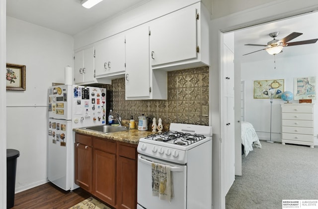 401 S 38th Ave, Omaha, NE 68131 - kitchen with white appliances, a sink, a ceiling fan, tasteful backsplash, and white cabinetry