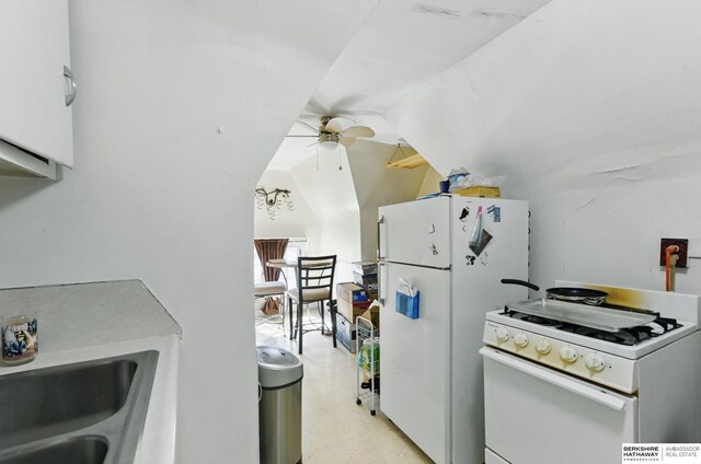 401 S 38th Ave, Omaha, NE 68131 - kitchen with white appliances, ceiling fan, vaulted ceiling, and light flooring