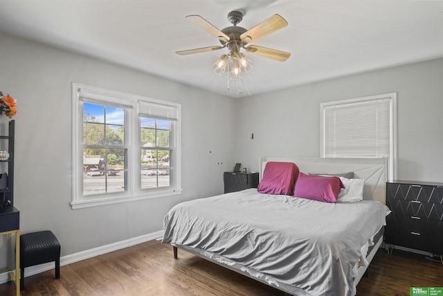 4921 Charles St, Omaha, NE 68132 - bedroom with wood finished floors, baseboards, and ceiling fan