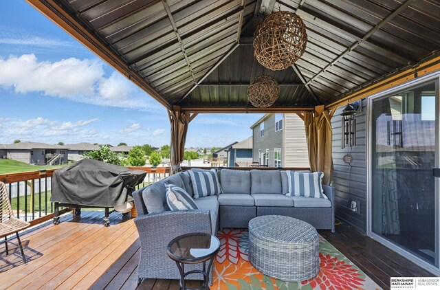wooden terrace with an outdoor living space, a gazebo, grilling area, and a residential view