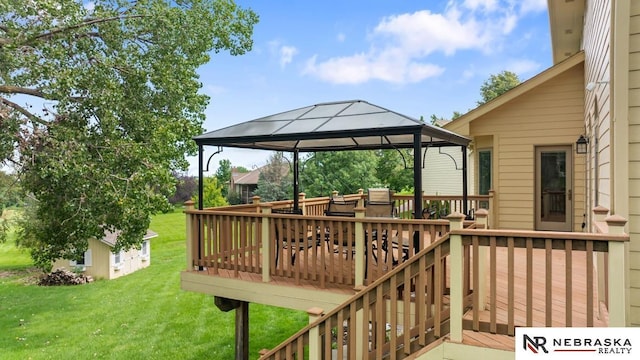 wooden deck with a gazebo and a yard