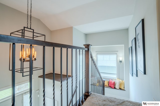 6707 S 209th St, Omaha, NE 68022 - stairs featuring a chandelier, vaulted ceiling, carpet floors, and baseboards