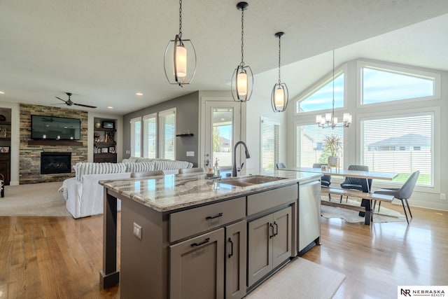 6707 S 209th St, Omaha, NE 68022 - kitchen with a sink, dishwasher, light wood finished floors, gray cabinets, and a ceiling fan