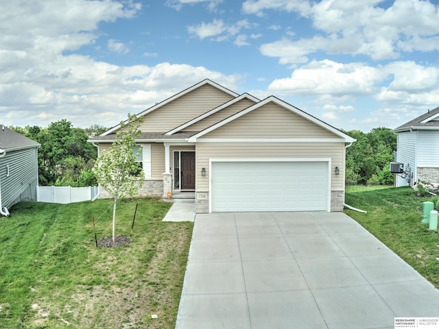 view of front of home with stone siding, a garage, and driveway