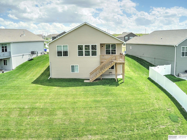 back of property with stairway and a wooden deck