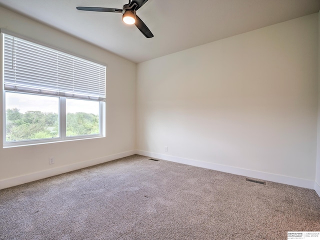 empty room with baseboards, carpet, and ceiling fan