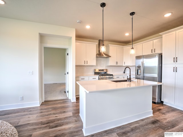 kitchen with a sink, stainless steel appliances, light countertops, white cabinetry, and dark wood-type flooring