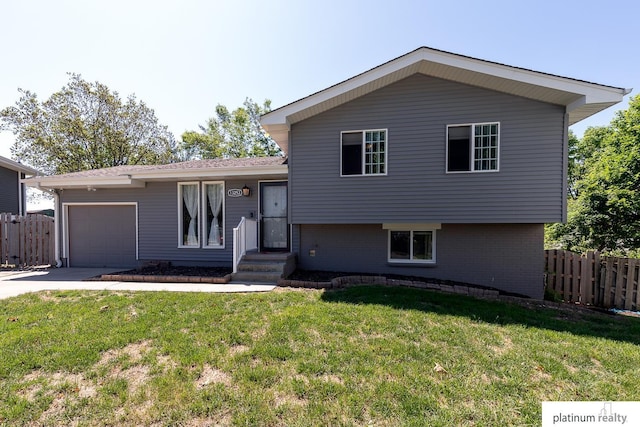 13253 Josephine St, Omaha, NE 68138 - tri-level home with an attached garage, concrete driveway, and brick siding