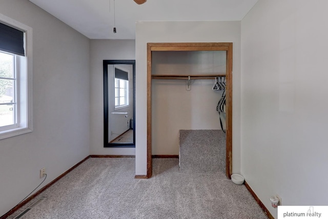13253 Josephine St, Omaha, NE 68138 - unfurnished bedroom with carpet floors, a closet, baseboards, and ceiling fan