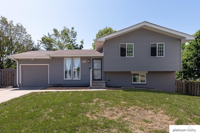 13253 Josephine St, Omaha, NE 68138 - tri-level home with an attached garage, driveway, and brick siding