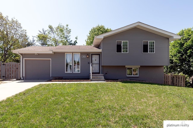 13253 Josephine St, Omaha, NE 68138 - tri-level home with an attached garage, concrete driveway, and brick siding