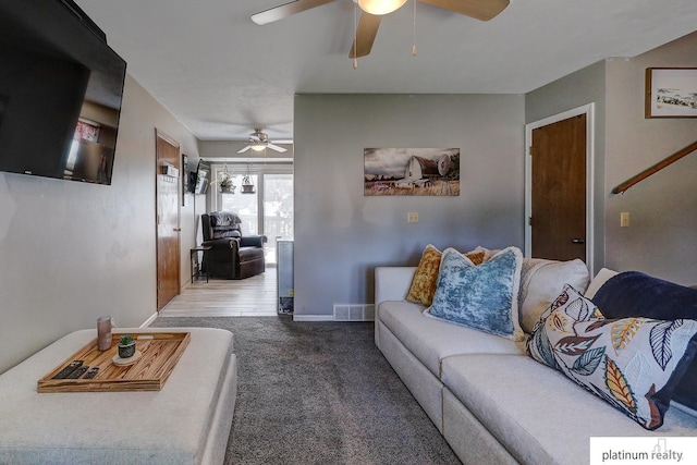 13253 Josephine St, Omaha, NE 68138 - living room featuring ceiling fan, carpet, and baseboards