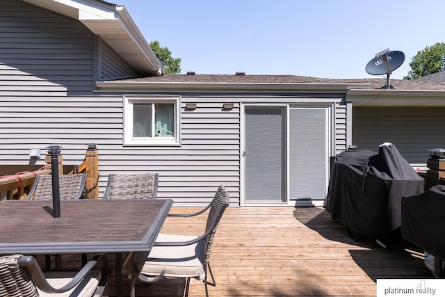 13253 Josephine St, Omaha, NE 68138 - wooden deck with outdoor dining space and a grill