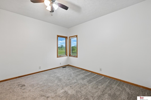 60050 Karns Rd, Pacific Junction, IA 51561 - carpeted empty room featuring baseboards, ceiling fan, and a textured ceiling