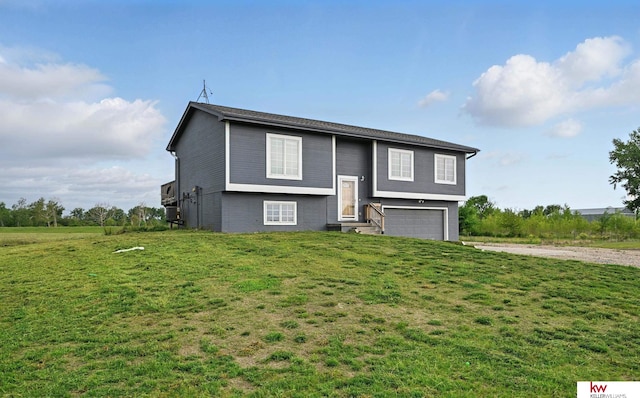 60050 Karns Rd, Pacific Junction, IA 51561 - raised ranch featuring entry steps, an attached garage, driveway, and a front lawn