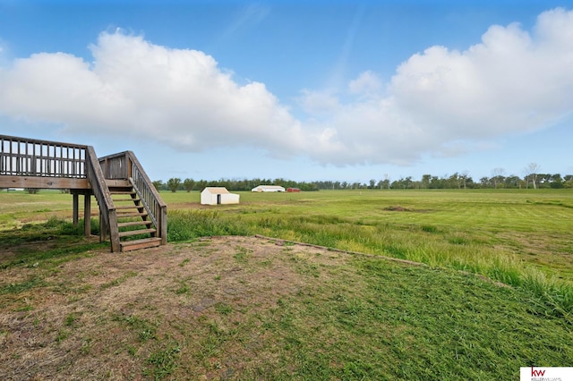 60050 Karns Rd, Pacific Junction, IA 51561 - view of yard featuring a wooden deck, a view of rural / pastoral area, and stairway