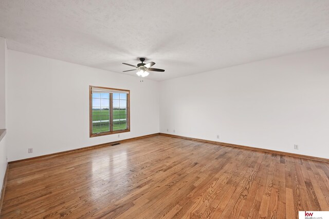 60050 Karns Rd, Pacific Junction, IA 51561 - empty room featuring ceiling fan, light wood finished floors, and baseboards
