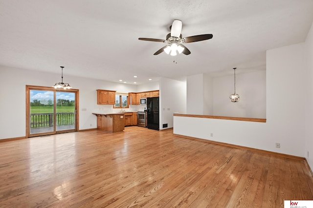60050 Karns Rd, Pacific Junction, IA 51561 - unfurnished living room featuring a chandelier, light wood-style flooring, baseboards, a ceiling fan, and recessed lighting