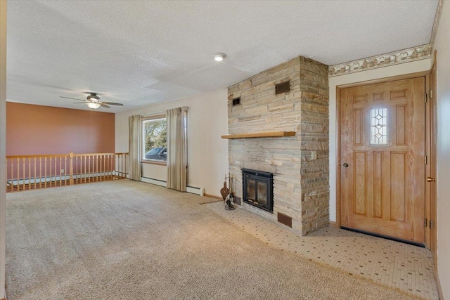 unfurnished living room with a ceiling fan, a textured ceiling, a stone fireplace, carpet flooring, and a baseboard heating unit