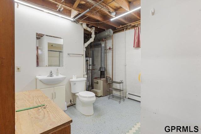 bathroom with a baseboard radiator, toilet, speckled floor, vanity, and a shower