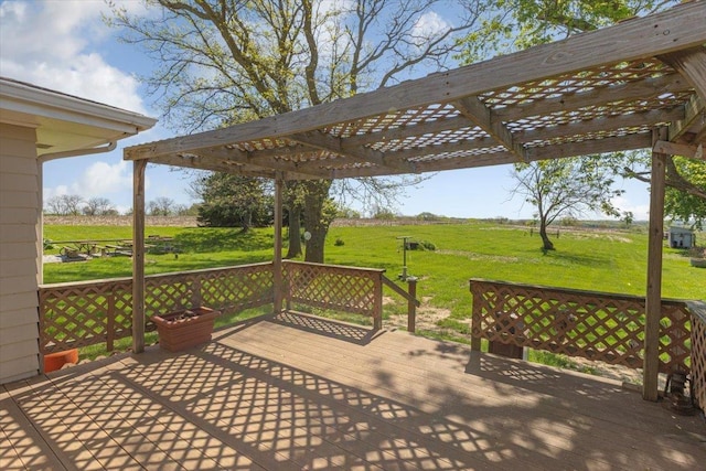 wooden deck with a pergola, a yard, and a view of rural / pastoral area