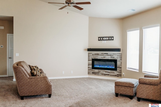 7202 N 167th Ave, Bennington, NE 68007 - carpeted living area with a ceiling fan, a fireplace, and baseboards