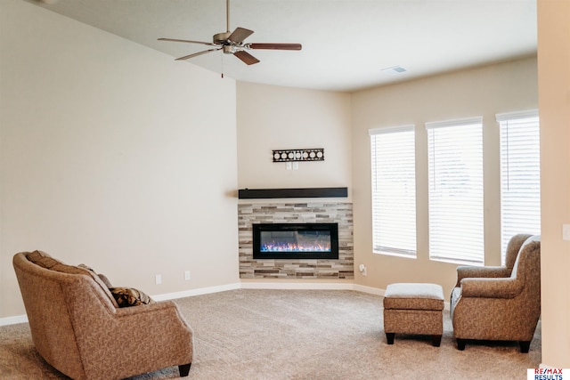 7202 N 167th Ave, Bennington, NE 68007 - carpeted living area with ceiling fan, baseboards, and a fireplace