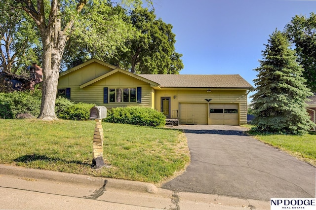 2352 Lincoln St, Blair, NE 68008 - view of front of home with a garage, a front yard, and driveway